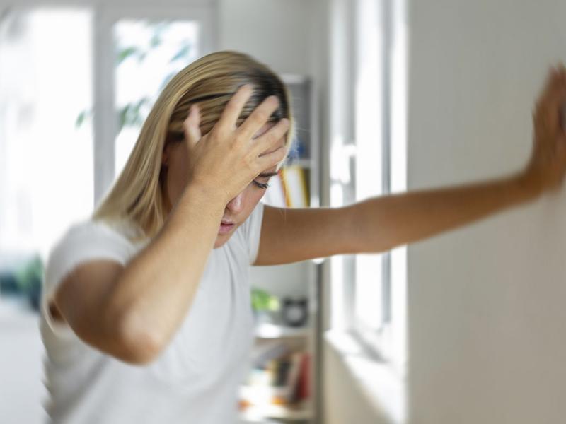 Woman experiencing vertigo