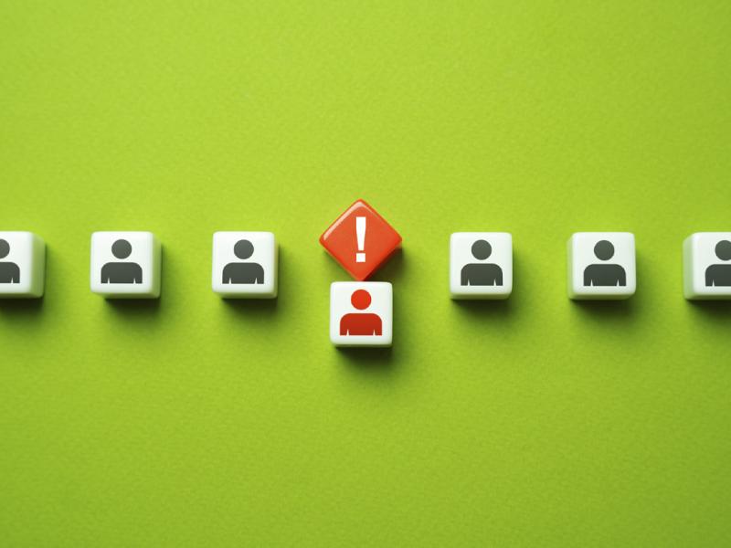 Row of figures with one called out by an exclamation point