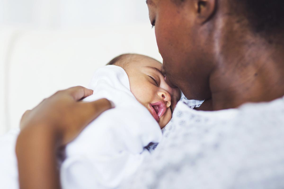 Woman holding newborn baby