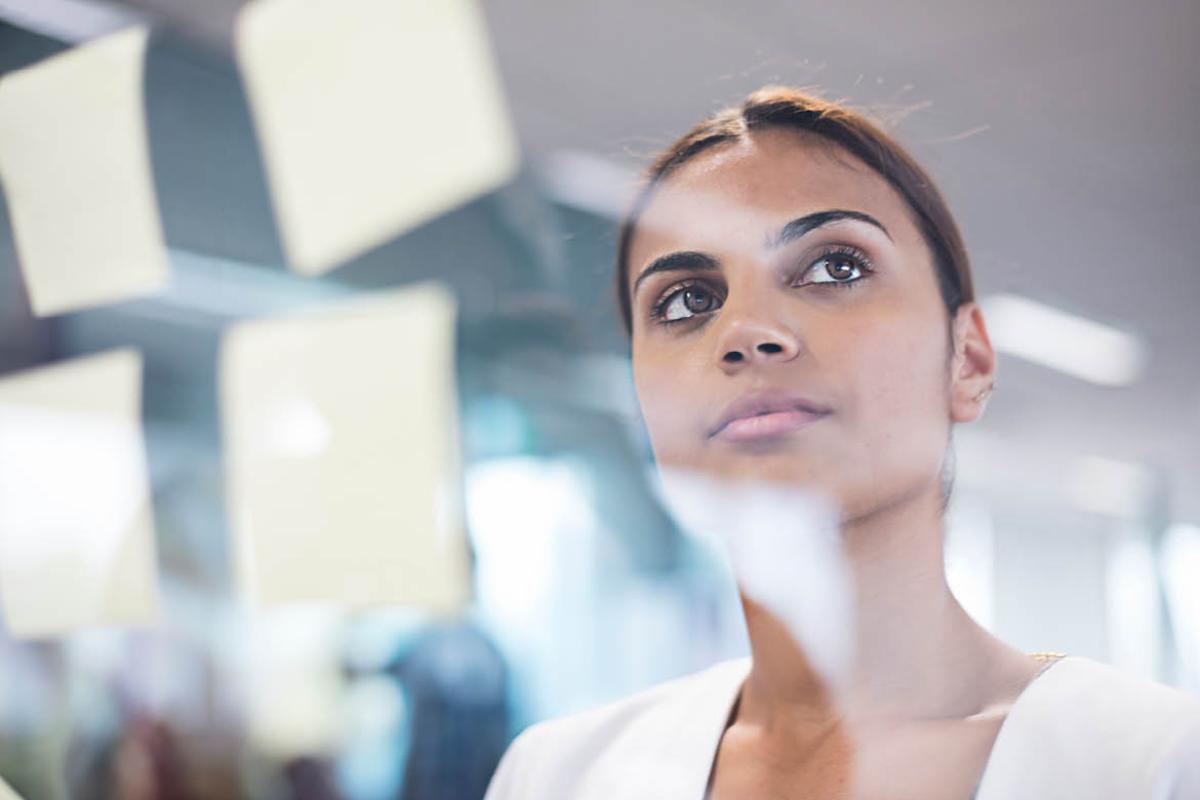 Woman staring through glass