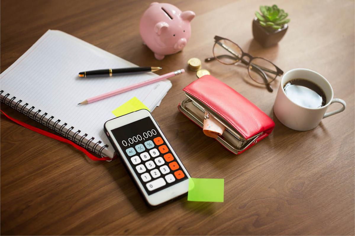 Desk with note pad, smart phone