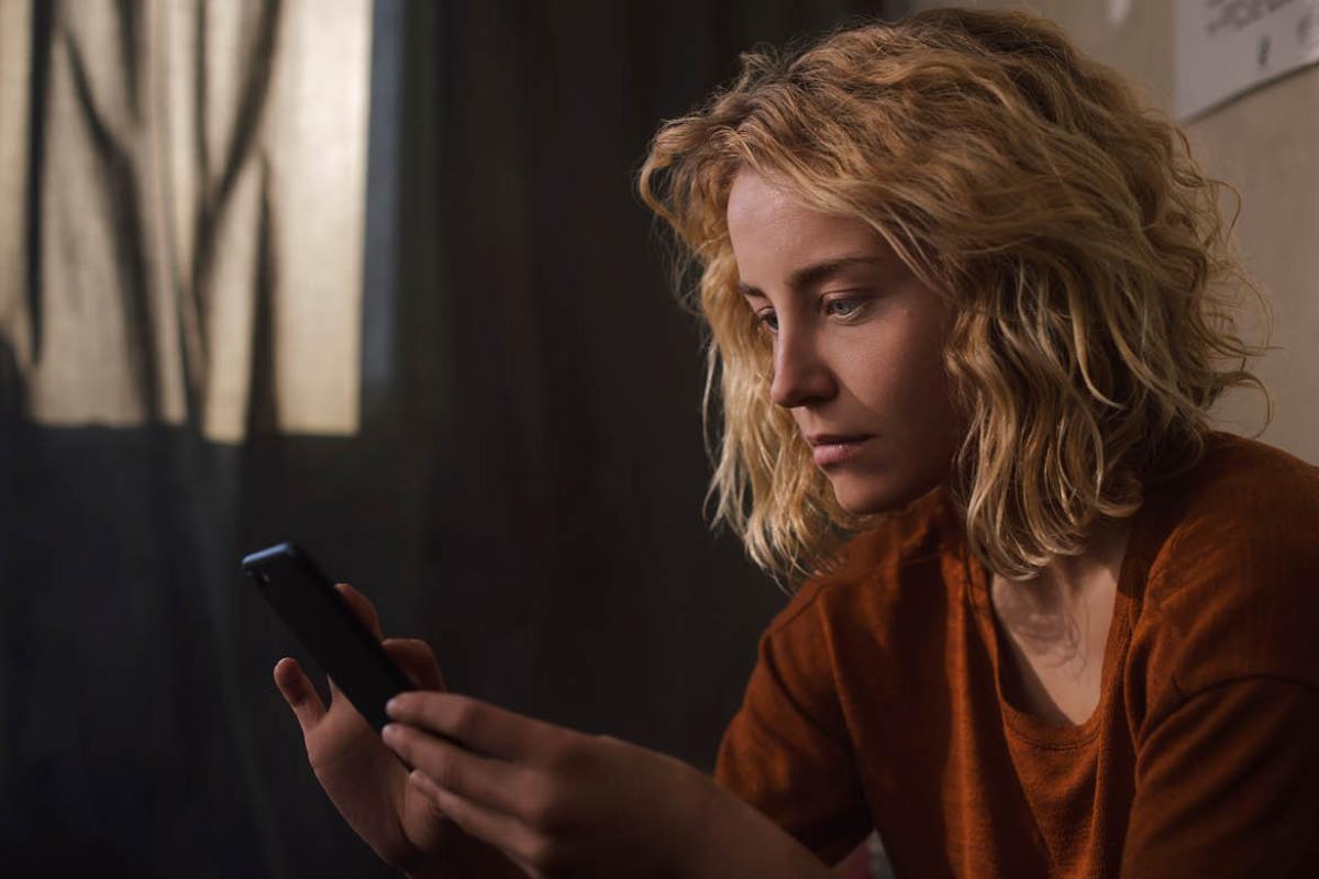 Woman looking at smartphone