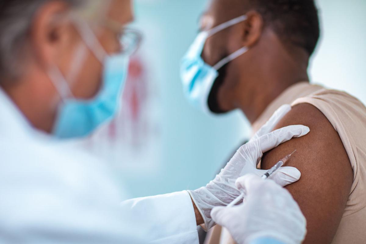 Physician giving a vaccination