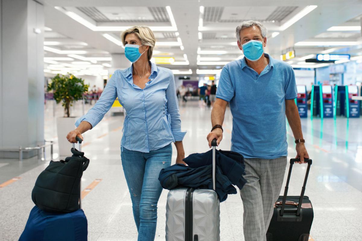 Two people wearing face masks