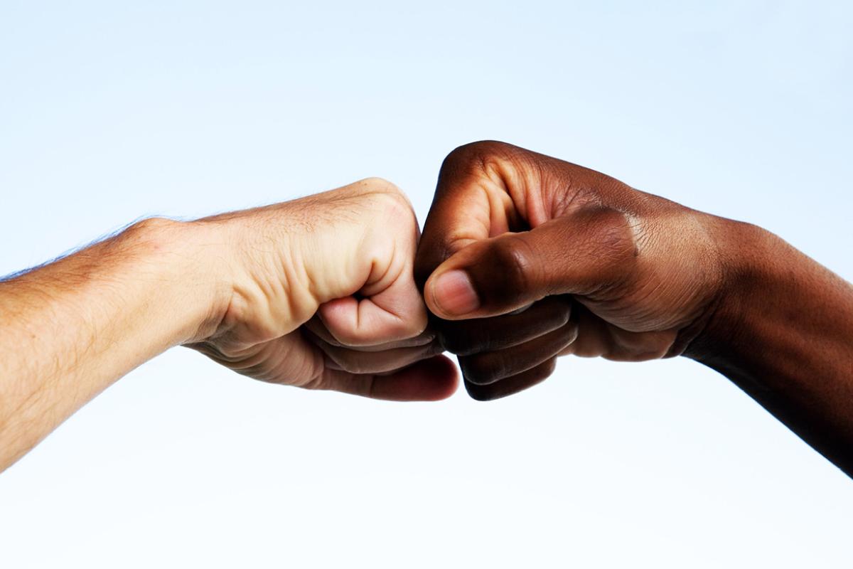 Two hands giving each other a greeting
