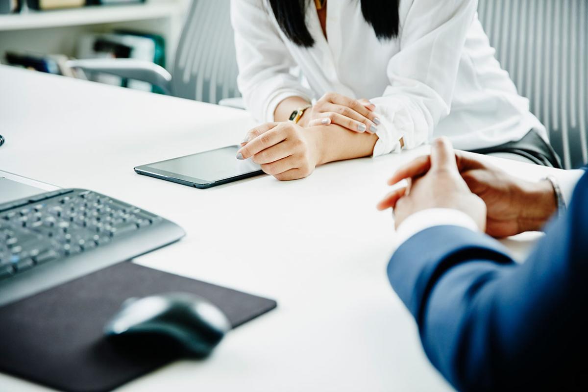 Businesspeople working on project on digital tablet in office conference room