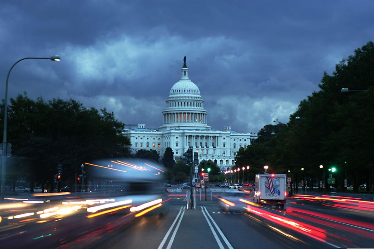 U.S. Capitol with traffic in the foreground