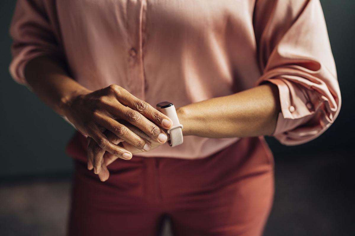 Person looking at a smartwatch on their wrist