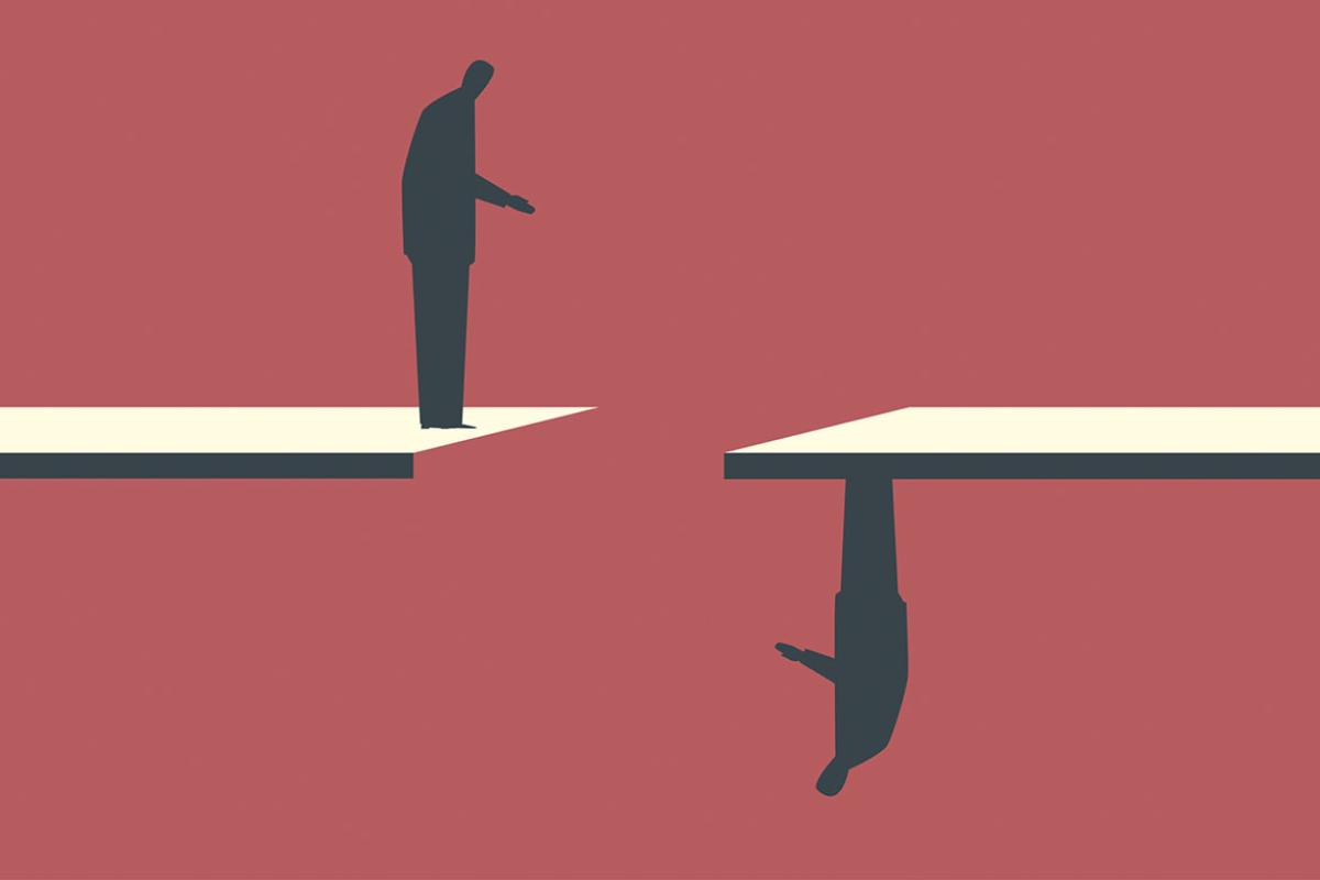 Two businesspeople are standing opposite each other