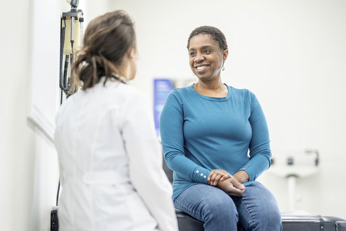 Smiling patient with physician
