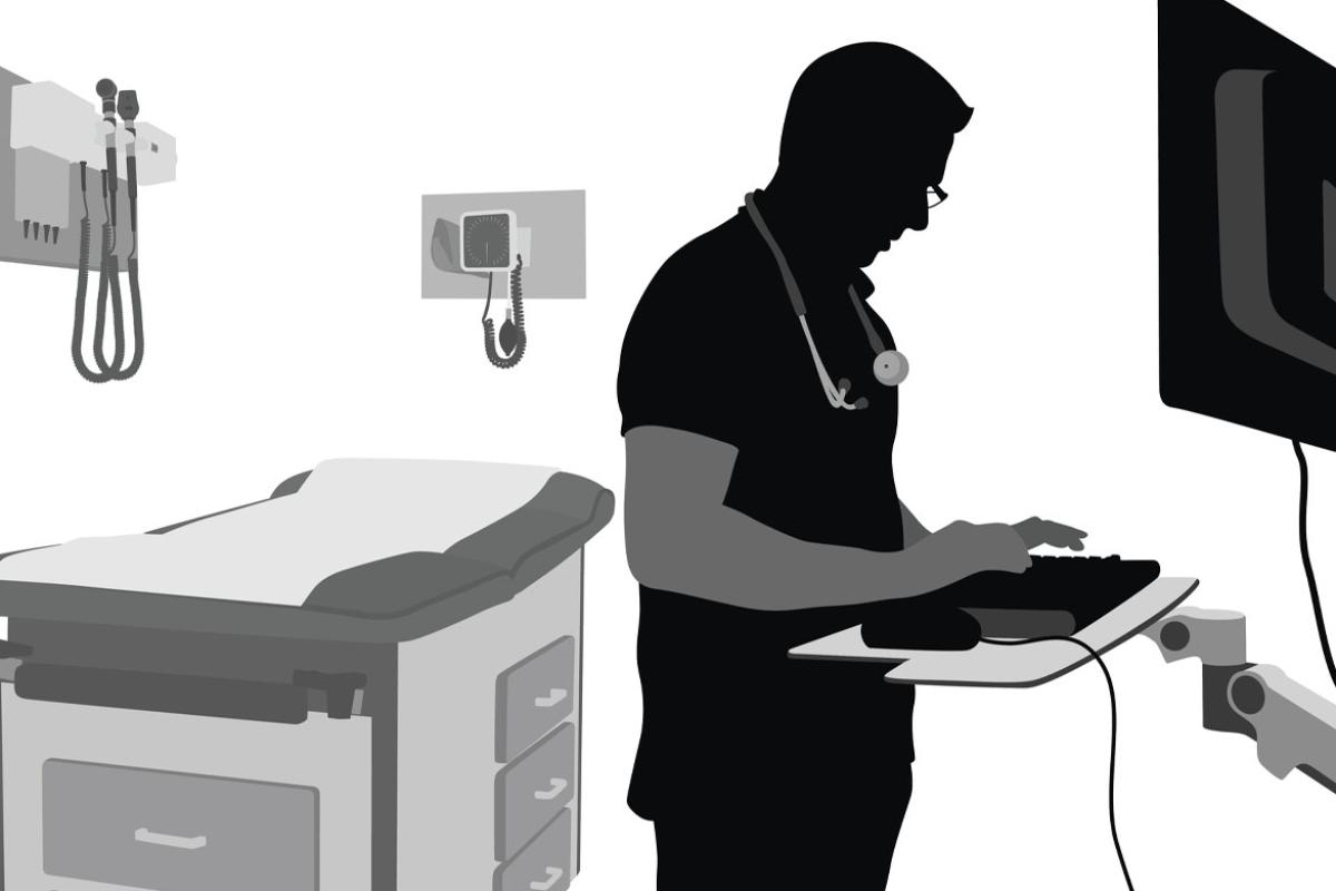 Silhouette illustration of a doctor using the computer in his exam room