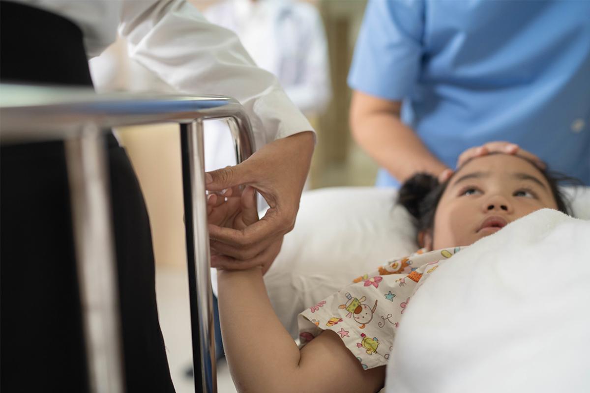 Young child in hospital bed