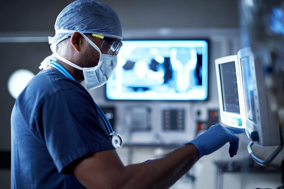 Surgeon looking at a monitor in an operating room
