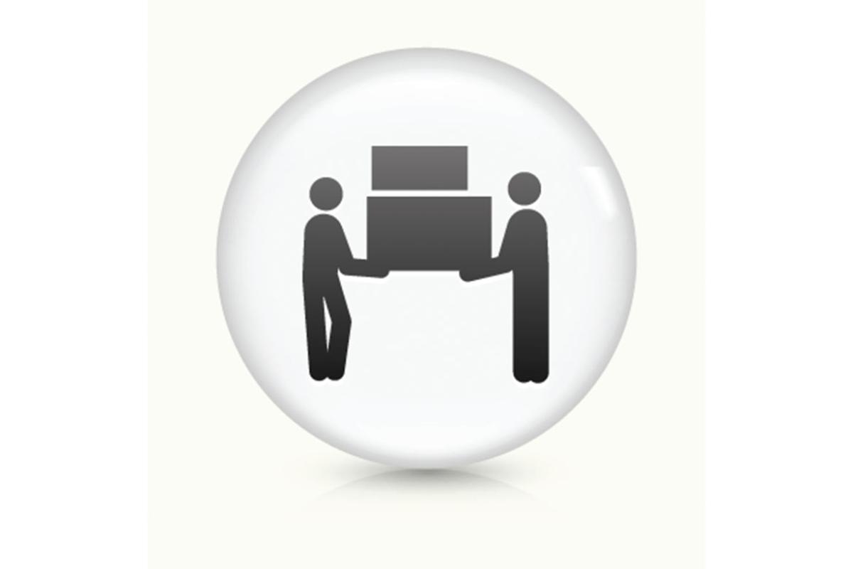 Two figures moving furniture