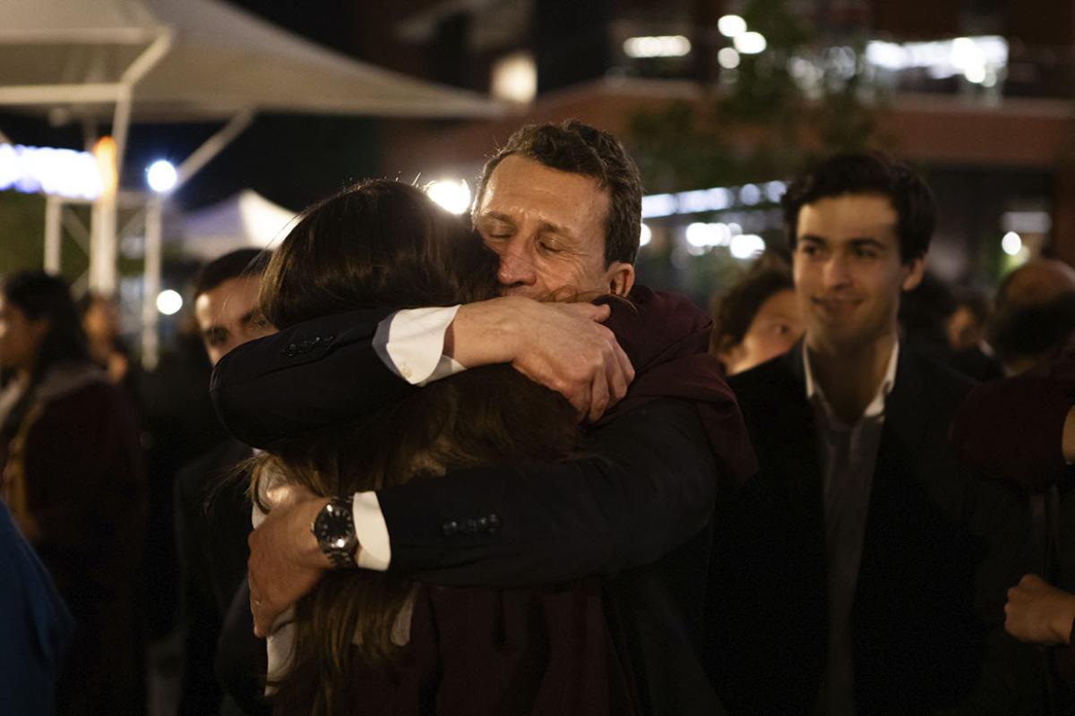 Two adults hugging