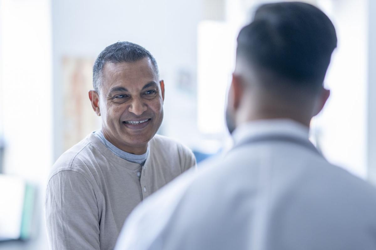 Smiling patient with physician
