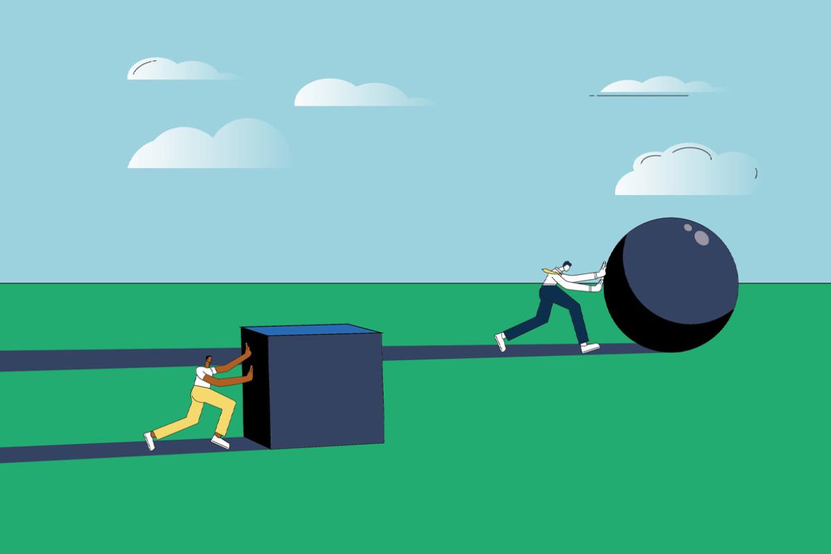 Two figures push giant blocks