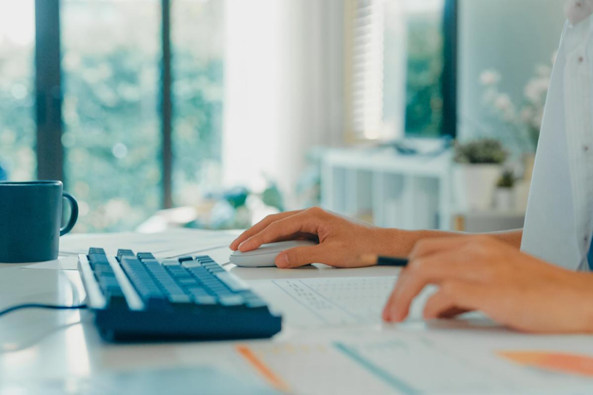 Person typing on keyboard