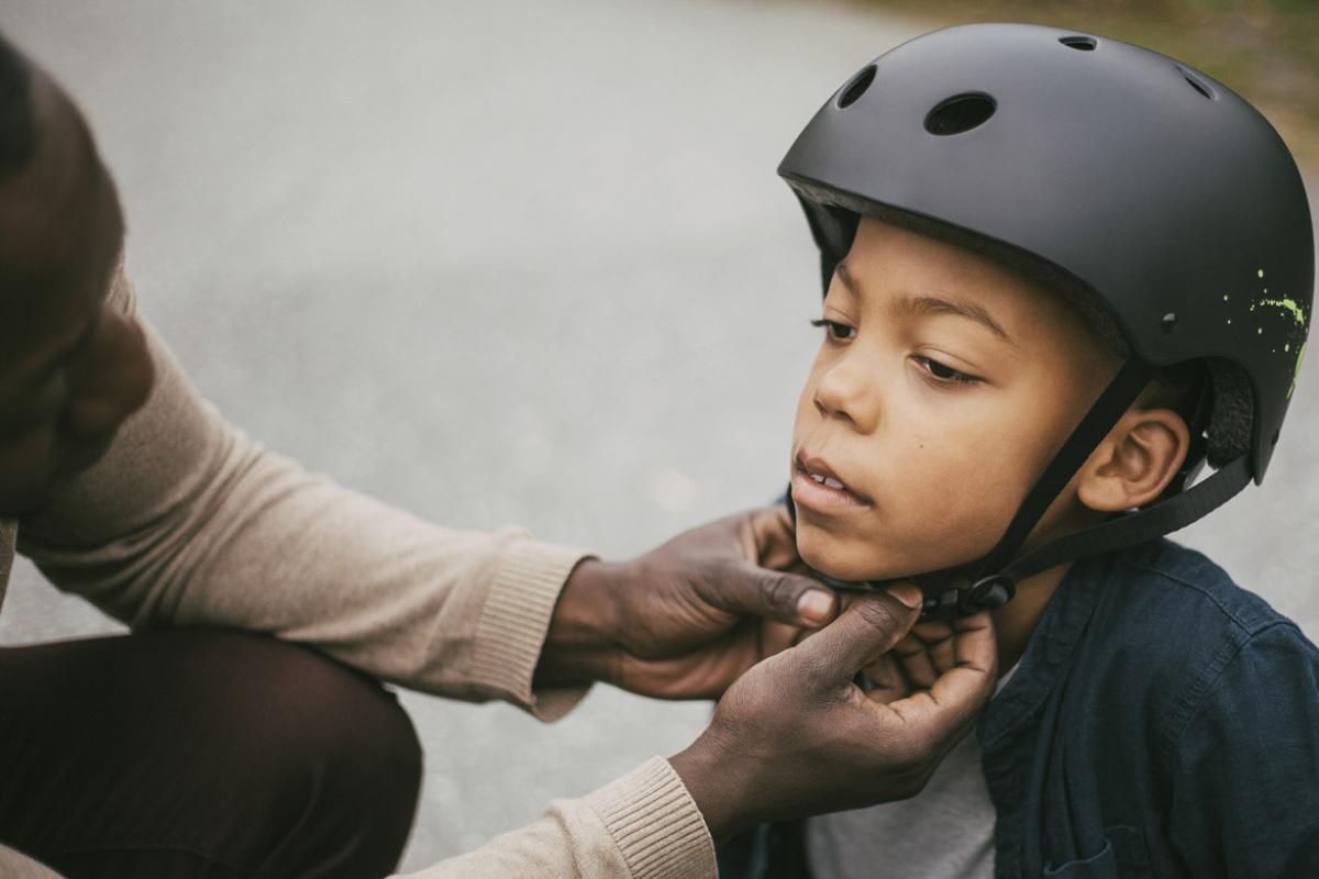Child is fitted with a helmet