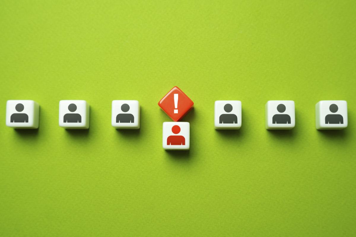 Row of figures with one called out by an exclamation point