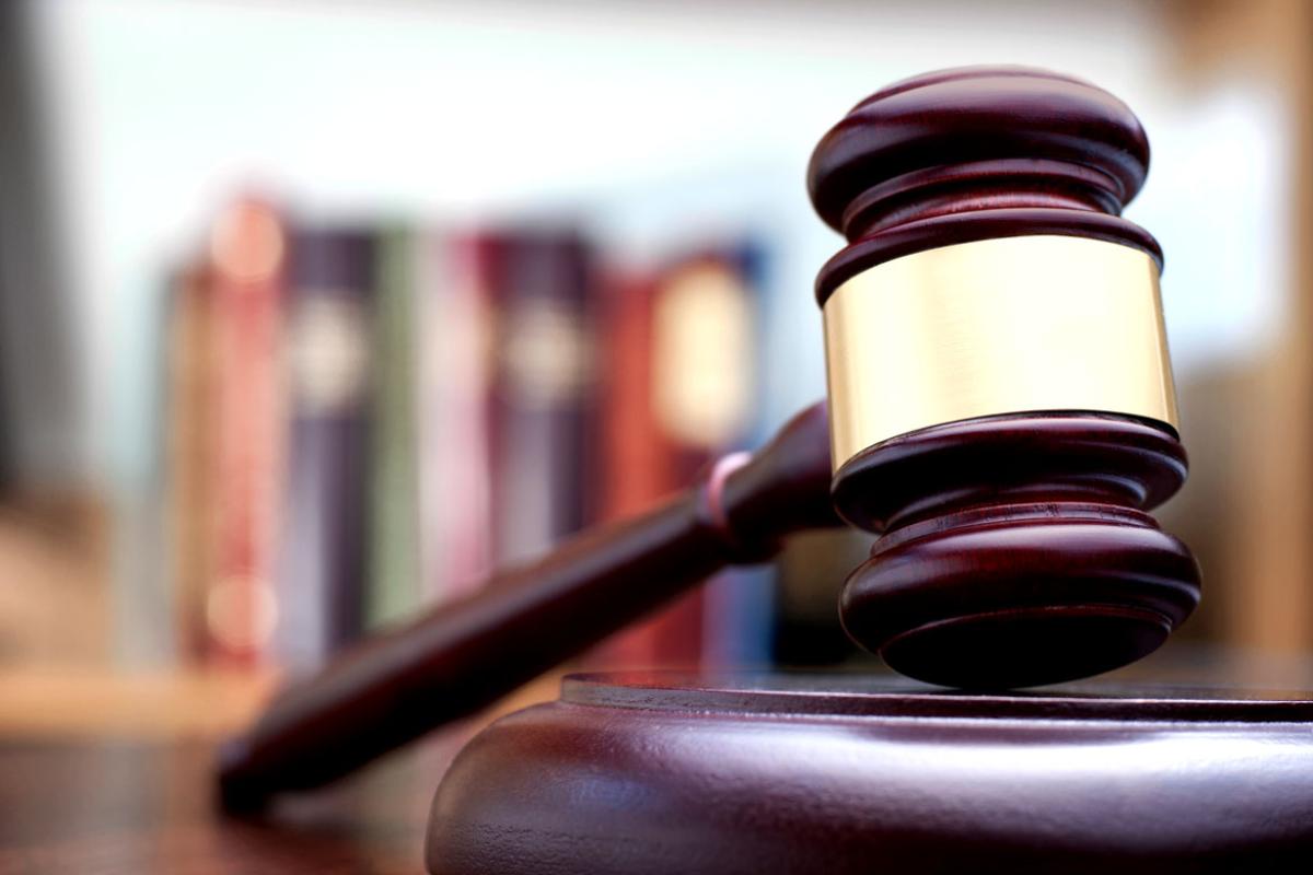 Courtroom gavel on a desktop in front of law books