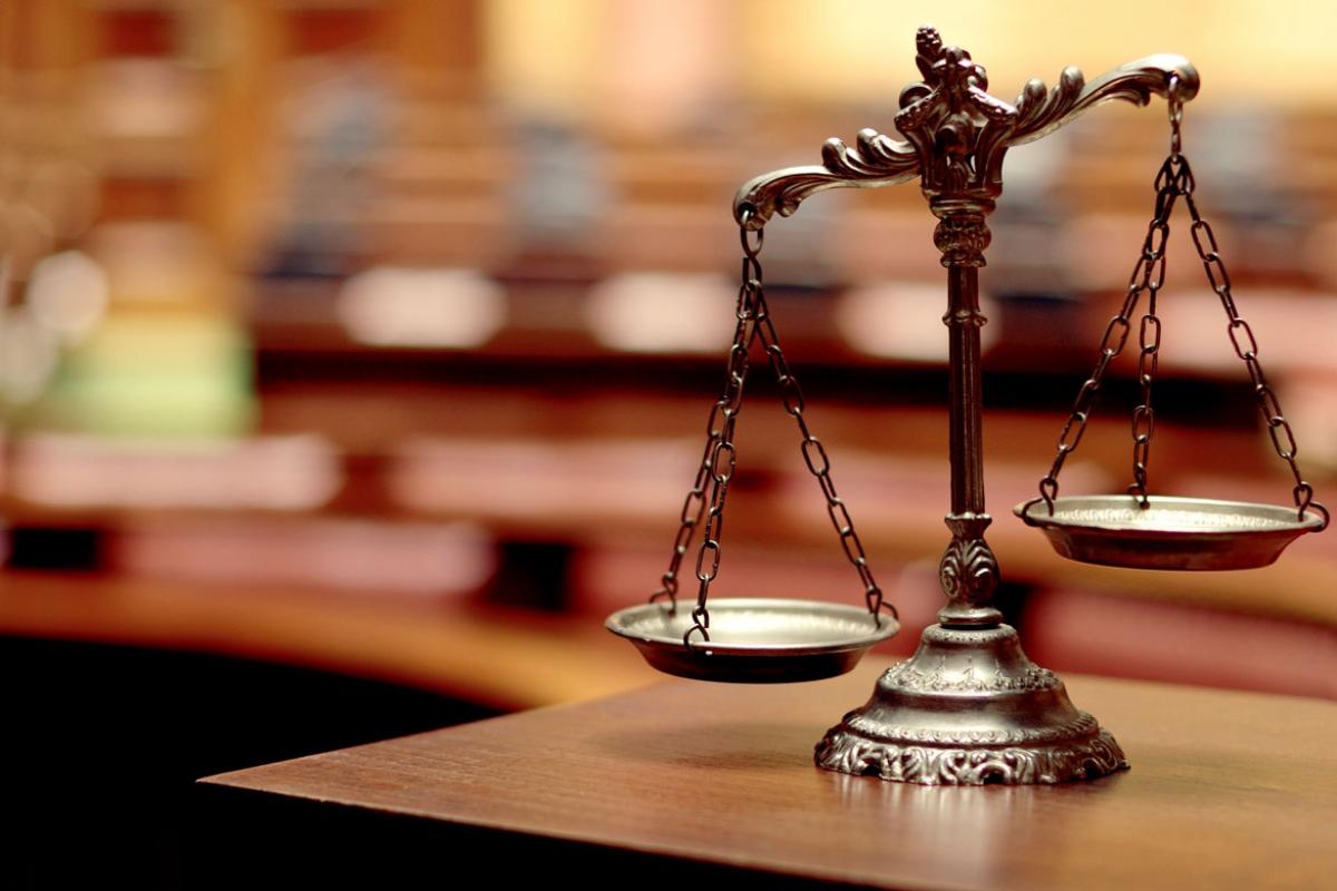 Unbalanced scales of justice.