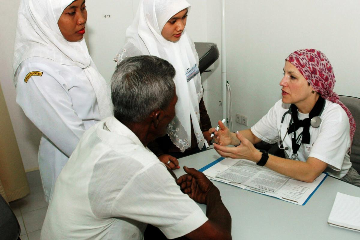 Four physicians gather for a discussion.