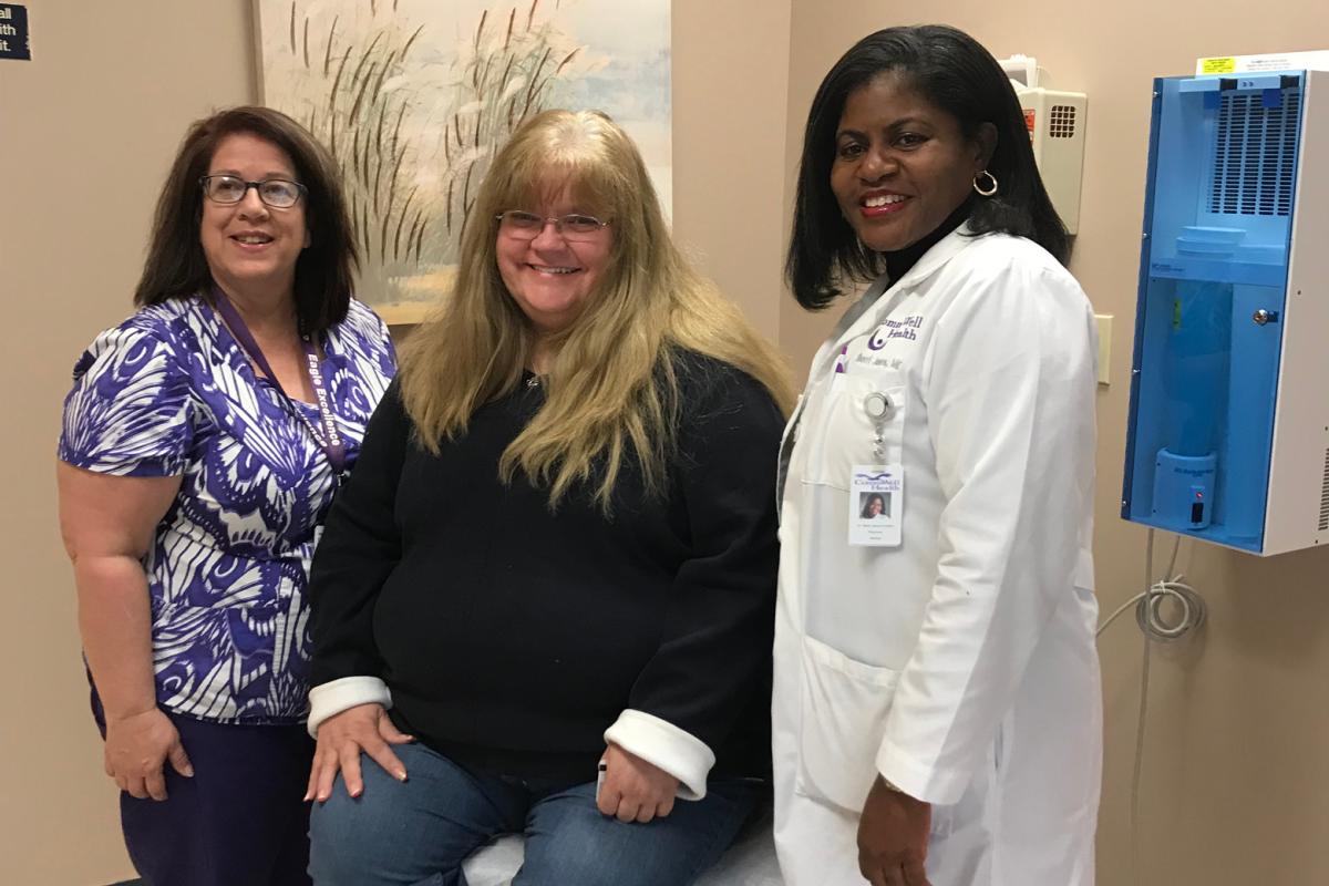 Health coach Dale Mangum with patient Lisa Porter and family physician Sherri James-Surger, MD.